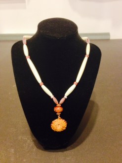 An antique Venetian Glass Trade Beads, Bone, Woven Cedar, and Copper Necklace by Joan Turecki This handmade necklace is unique to Northwest BC. The Natural materials used can be found in the forests, waters and coastline.